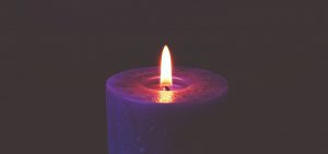 photo of lit blue candle by George Becker, courtesy of Pexel.com