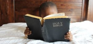 Photo by nappy from Pexels, child with Bible